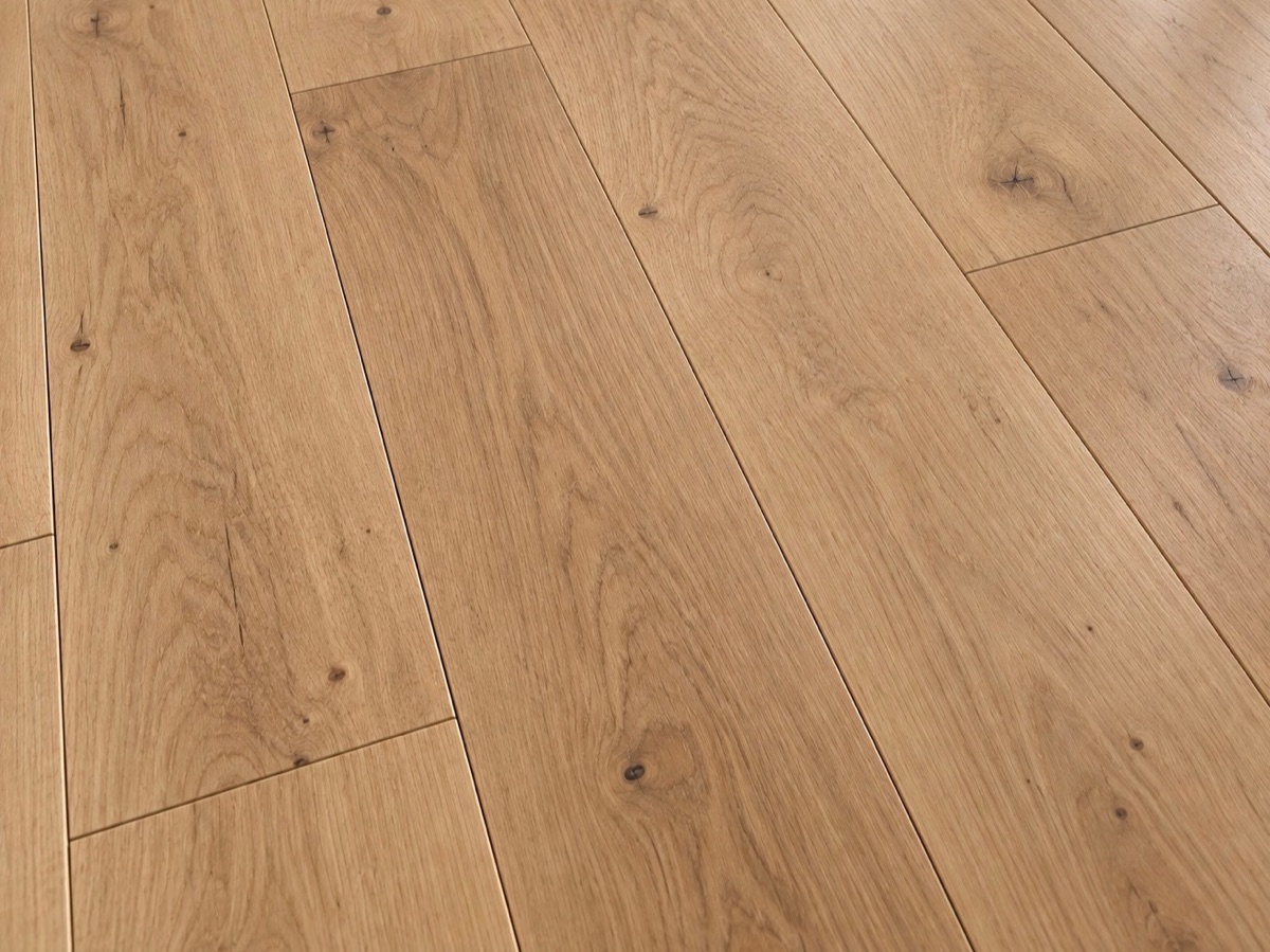 White oak hardwood planks with warm golden grain and small knots